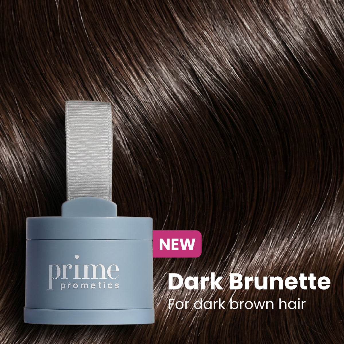 A blue Prime Prometics container labeled Dark Brunette for dark brown hair sits on shiny, dark brown hair. A pink NEW tag highlights the products launch.