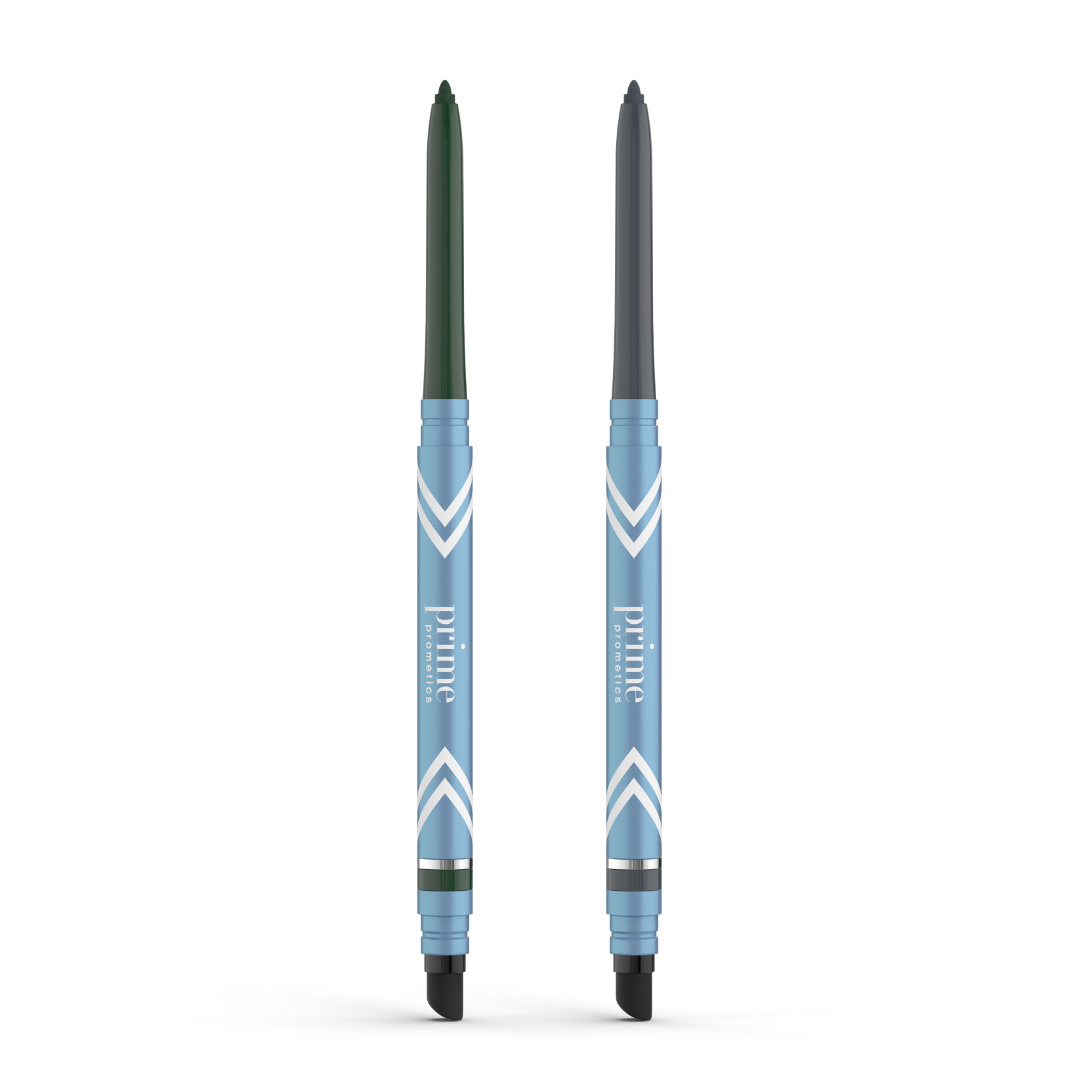 Two blue PrimePrometics™ PrimeEyes Glide Eyeliner pencils stand upright, each with a white chevron design. The left pencil has a green tip, the right a gray tip. Both include smudgers and are ideal water-resistant eyeliner for mature eyelids.