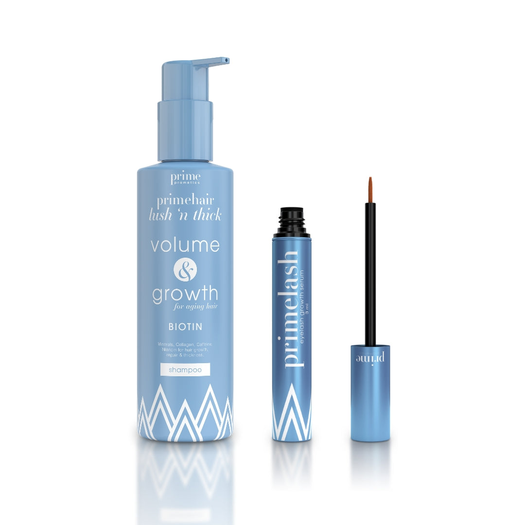 Two blue PrimePrometics™ products on a white background: a PrimeHair Lush N' Thick Shampoo pump bottle, and an open tube of PrimeLash Serum for eyelash and brow growth.