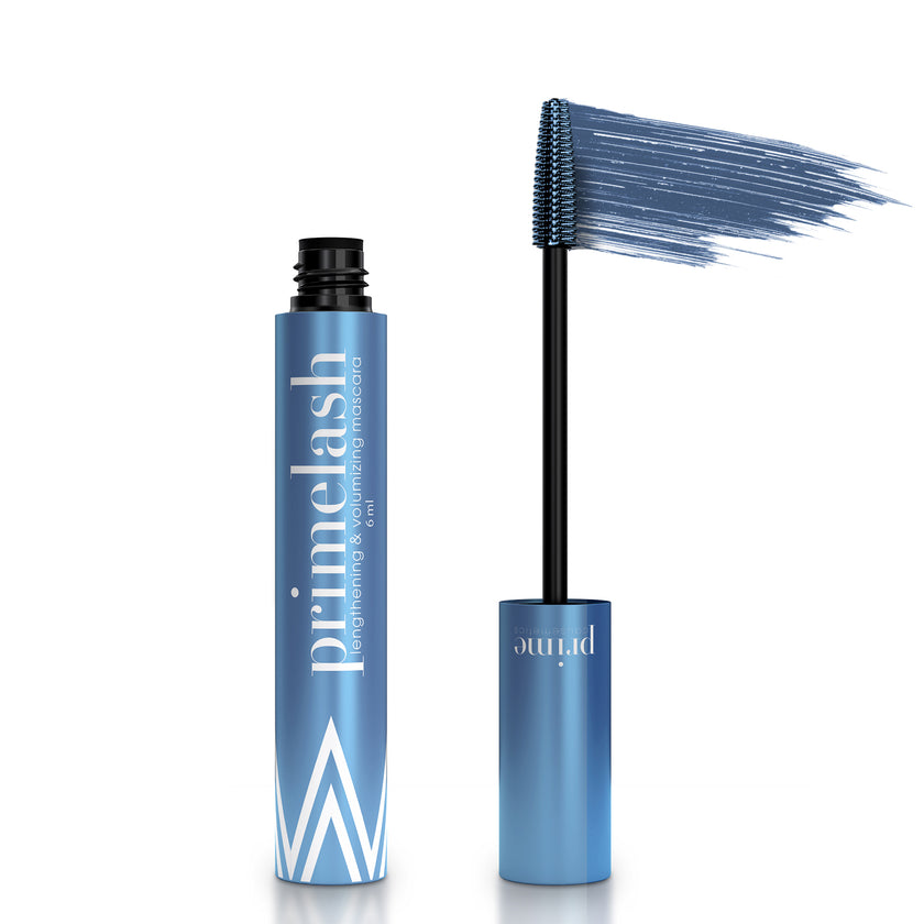 A blue tube of Primelash mascara stands upright with its wand removed, showing the brush coated in blue mascara and a swatch above it, against a white background.