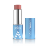 A blue tube of prime wand cream blush with the lid off, revealing a rosy pink stick. The lid stands upright next to the product, displaying the white primewand text vertically.