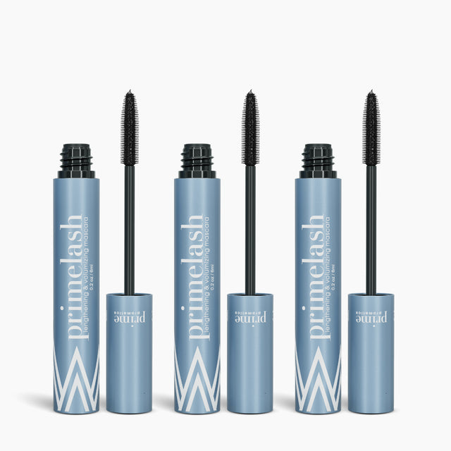 Three open tubes of PrimePrometics™ 3pcs PrimeLash Mascara, featuring a blue and white design, are lined up side by side with their black mascara wands on display.