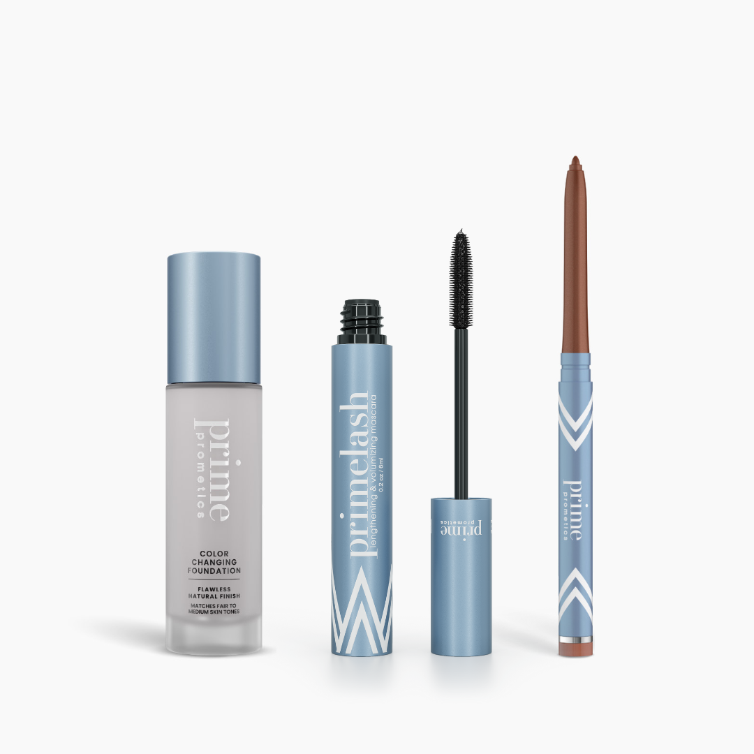 The PrimePrometics™ Prime Heroes Set features three blue-capped products—Color Changing Foundation, PrimeLash Mascara, and PrimeEyes Glide eyebrow pencil—displayed side by side on a white background.