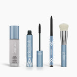 The PrimePrometics™ Prime Perfection Bundle features Color Changing Foundation, PrimeLash Mascara, PrimeEyes Glide Eyeliner, and a makeup brush in light blue and silver packaging displayed on a white background.