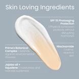 A smear of beige and white cream on a grey background with text highlighting ingredients: SPF 15 for sun protection, Primes Botanical Complex for defense, Niacinamide for calming skin, and jojoba oil plus squalene for moisture.