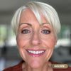 Mature woman with white hair wearing Prime Prometics PrimeEyes Glide Eyeliner in Golden, a metallic gold shade