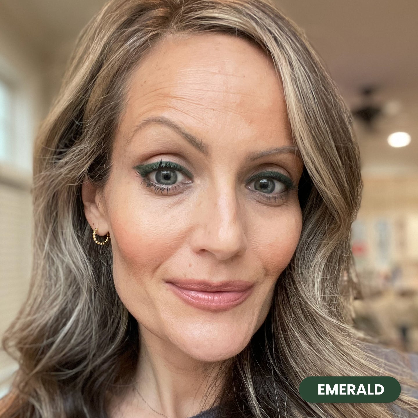 Mature woman wearing Prime Prometics PrimeEyes Glide Eyeliner in Emerald, a green shade
