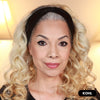 Mature woman with curly hair wearing Prime Prometics PrimeEyes Glide Eyeliner in Kohl, a black winged eyeliner look