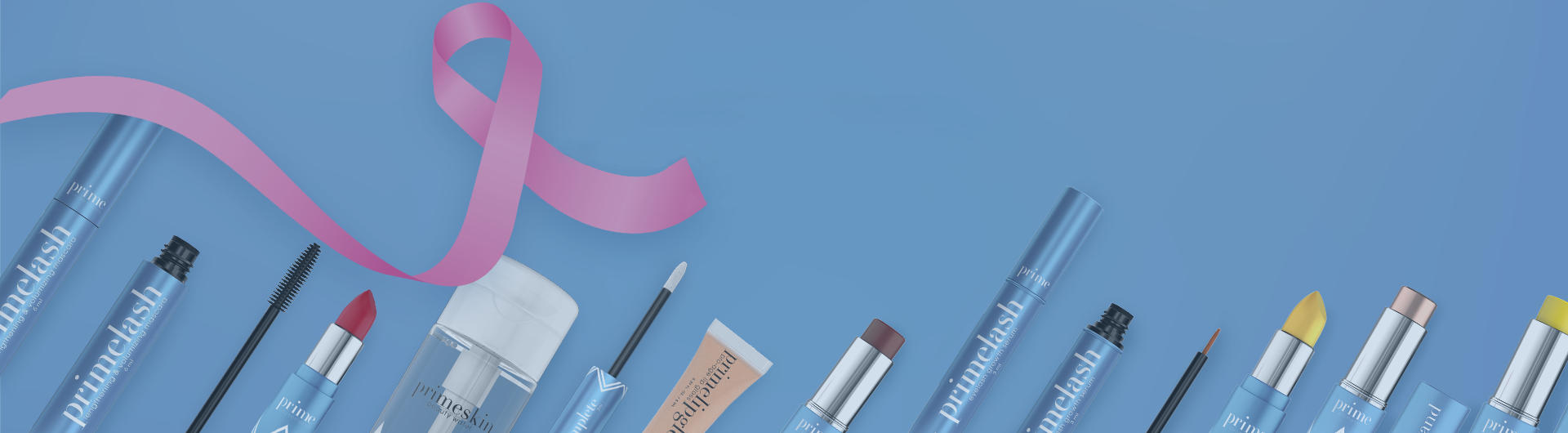 A row of blue makeup products, including lipsticks, mascara, and pencils, are arranged on a blue background with a pink ribbon looped above them, symbolizing breast cancer awareness.