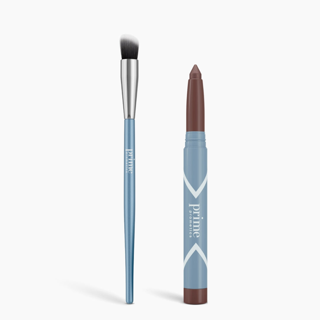 The Seamless Shadow Bundle Matte by PrimePrometics™ features a blue-handled cream eyeshadow brush with white-tipped bristles and a brown "prime" makeup stick in a light blue case, both upright on a white background—ideal for creating flawless matte eye looks.