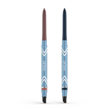 Two retractable PrimePrometics™ PrimeEyes Glide Eyeliners stand upright, each with a blue casing labeled "prime": the left has a brown tip, the right dark blue. Both pro-age eyeliners feature angled silver and white accents.