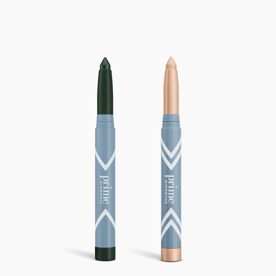 Two PrimePrometics™ 2pcs PrimeEyes Eye Brightener sticks, in blue and white packaging, stand upright; one has a dark green tip, the other a light beige tip––perfect for brightening eyes or using as under eye cream.