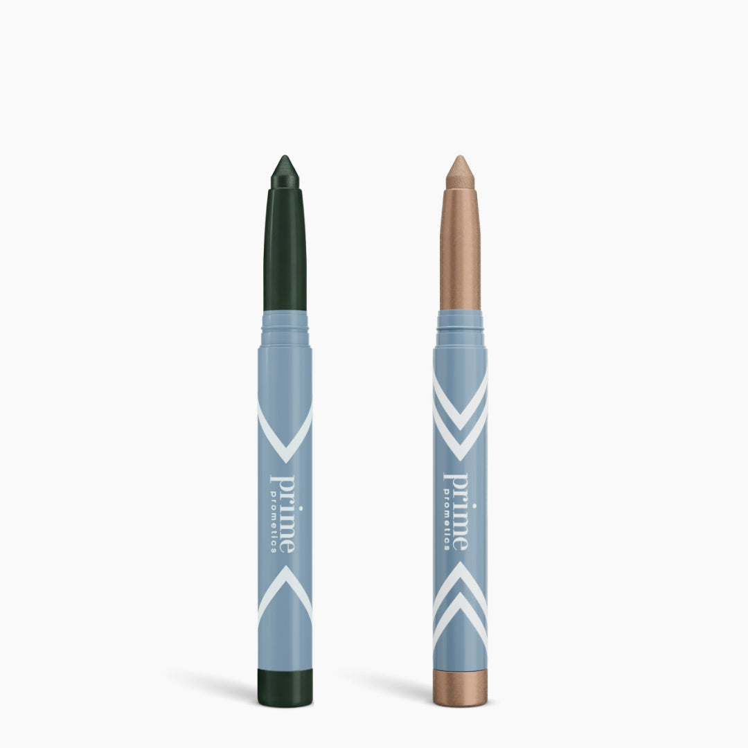 Two PrimePrometics™ PrimeEyes Eye Brightener sticks with blue and white packaging stand upright—one with a dark green tip, the other shimmery beige—ideal as an eye brightener or under eye cream. 2pcs per set.