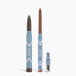 Two blue Eye Sculpt Duo pencils by PrimePrometics™ stand upright with a matching sharpener. Each pencil features brown and bronze tips for versatile eyeshadow matte or glide eyeliner looks, accented by white chevrons on a white background.