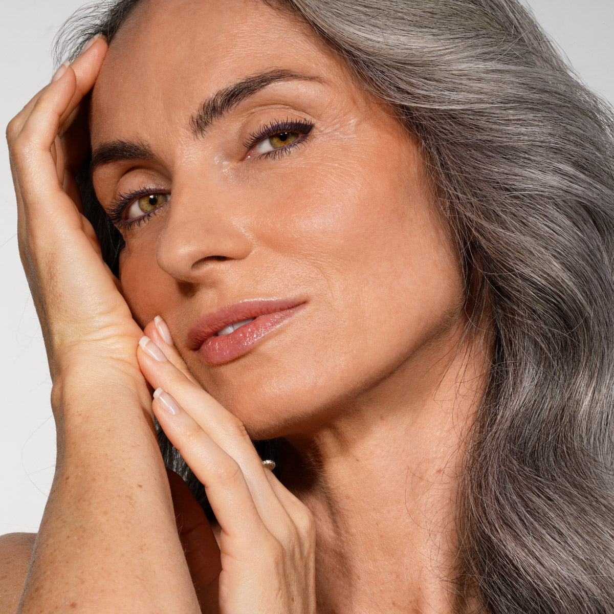 Mature woman with grey hair, Prime Prometics customer portrait.