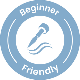 A blue circular badge with the words Beginner Friendly and an icon of a nail polish brush painting a curved line in the center.
