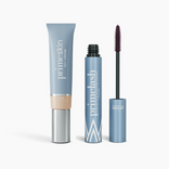 The Effortless Beauty Bundle by PrimePrometics™ features a tube of CC+ Cream and an open PrimeLash Mascara with its wand, both in sleek light blue packaging, displayed upright against a white background.