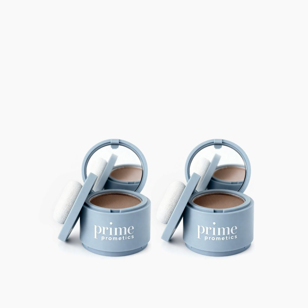 Two round light blue PrimePrometics™ containers labeled "2pcs Instant Coverage Hairline Powder" feature open lids, mirrors, and white applicator puffs. They provide instant hairline coverage or act as a hair concealer. Displayed on a plain white background.