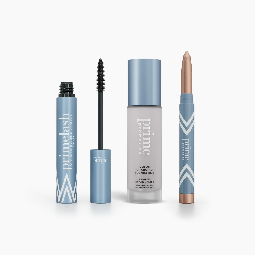 The Hollywood Glow Set by PrimePrometics™ features four blue makeup products on a white background: a mascara tube with wand, liquid foundation with pump, cream eyeshadow stick, all labeled "prime.