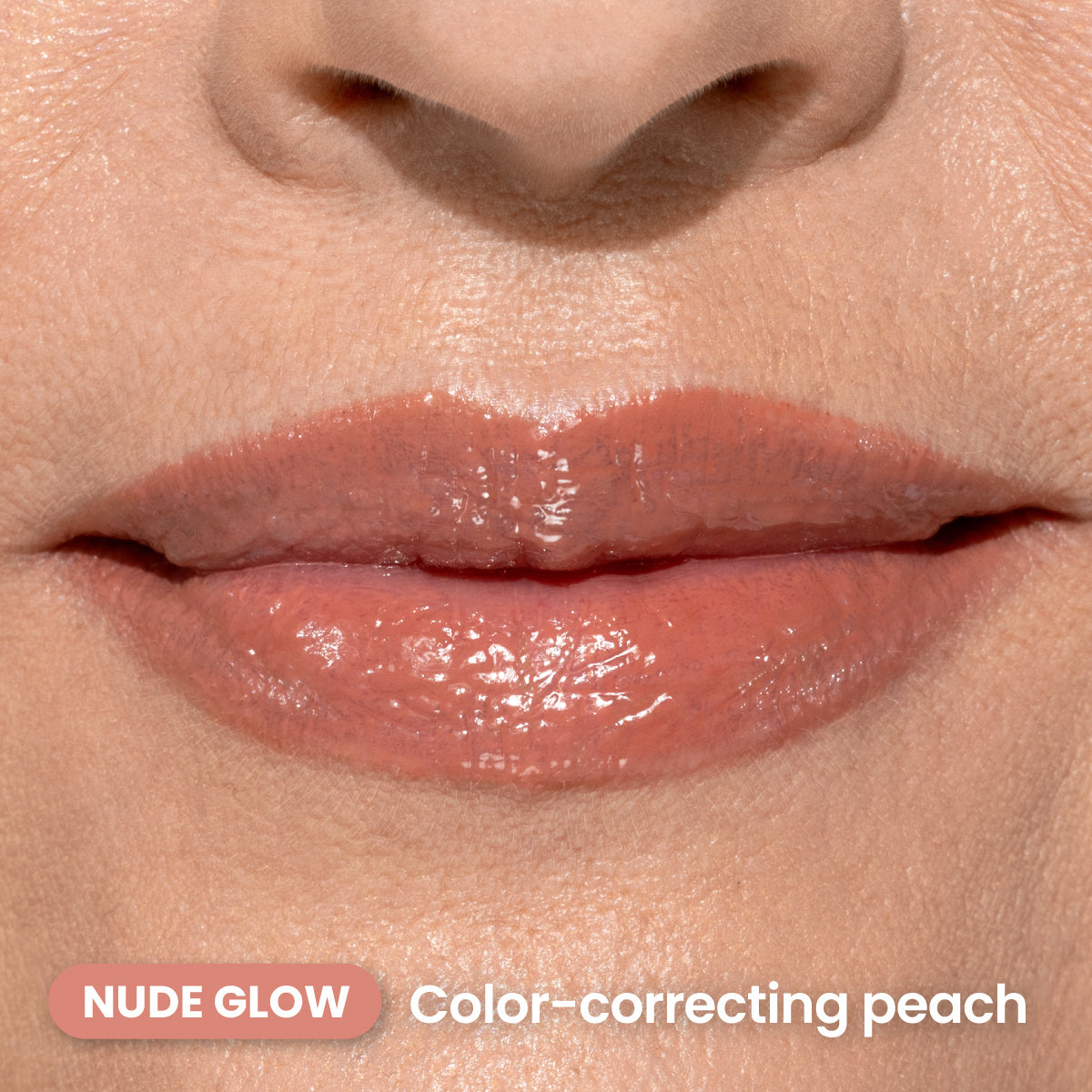 A close-up of lips wearing a glossy nude peach lipstick. Text on the image reads NUDE GLOW Color-correcting peach.