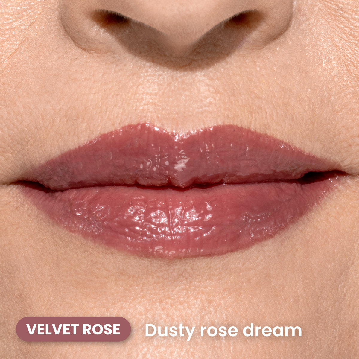 Close-up of lips wearing glossy, dusty rose-colored lipstick. The skin around the lips is smooth. Text on the image reads VELVET ROSE and Dusty rose dream.
