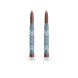Two mauve PrimePrometics™ 2pcs PrimeEyes Eye Brightener sticks, in blue and white chevron tubes labeled “prime,” stand upright on white—delivering effortless eye brightening and care in one sleek package.