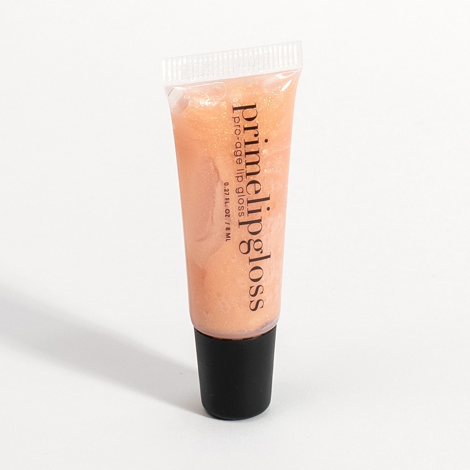 Prime Prometics PrimeLip Gloss tube shown at an angle, displaying its shimmery peach formula