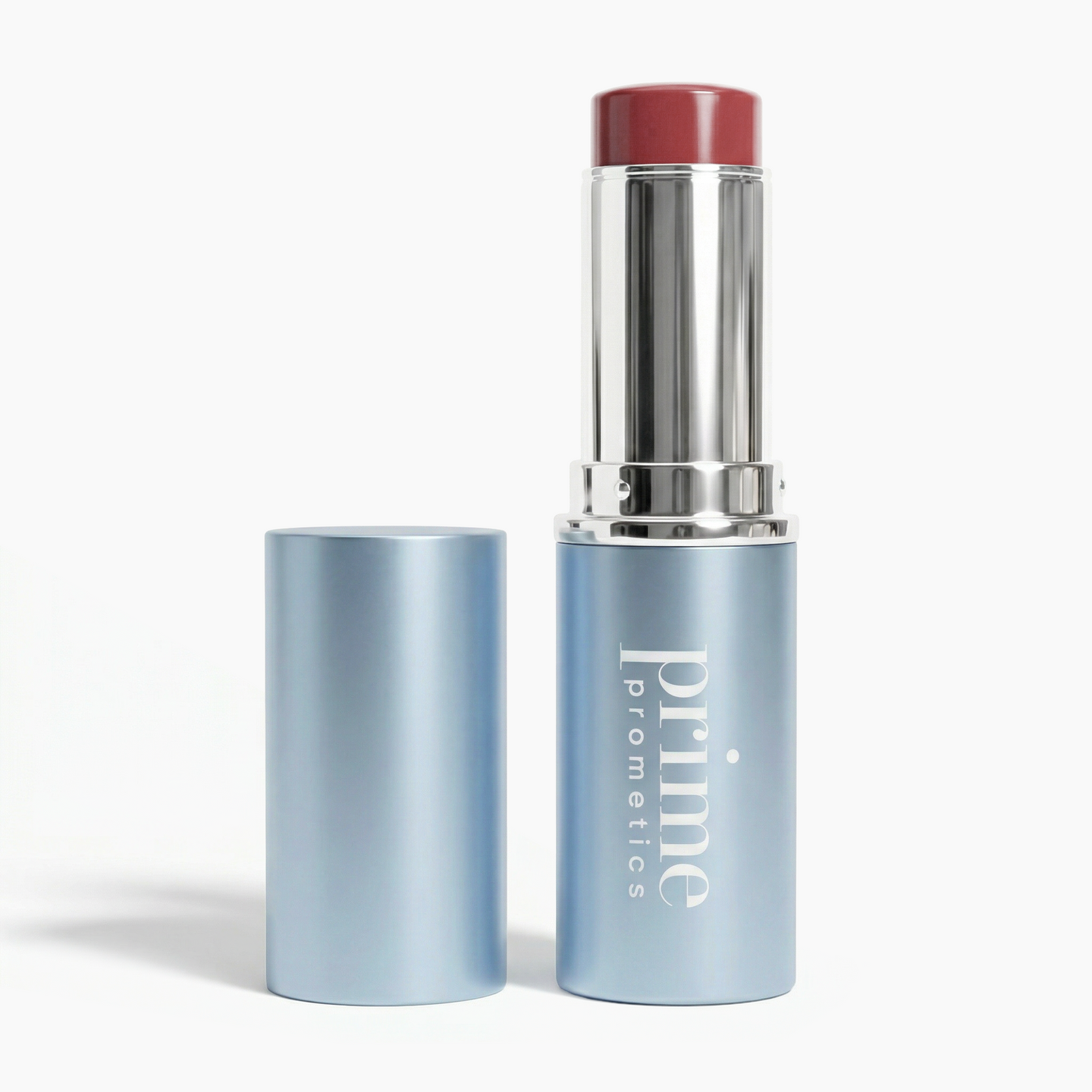 A silver and light blue tube of PrimePrometics™ PrimeWands 5-in-1 Makeup Wand with the cap off, revealing a rosy mauve product inside—a skincare-infused makeup stick that delivers buildable color for any occasion.