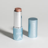 Prime Prometics PrimeWand Pearl shimmer stick with cap off, displayed on a neutral background