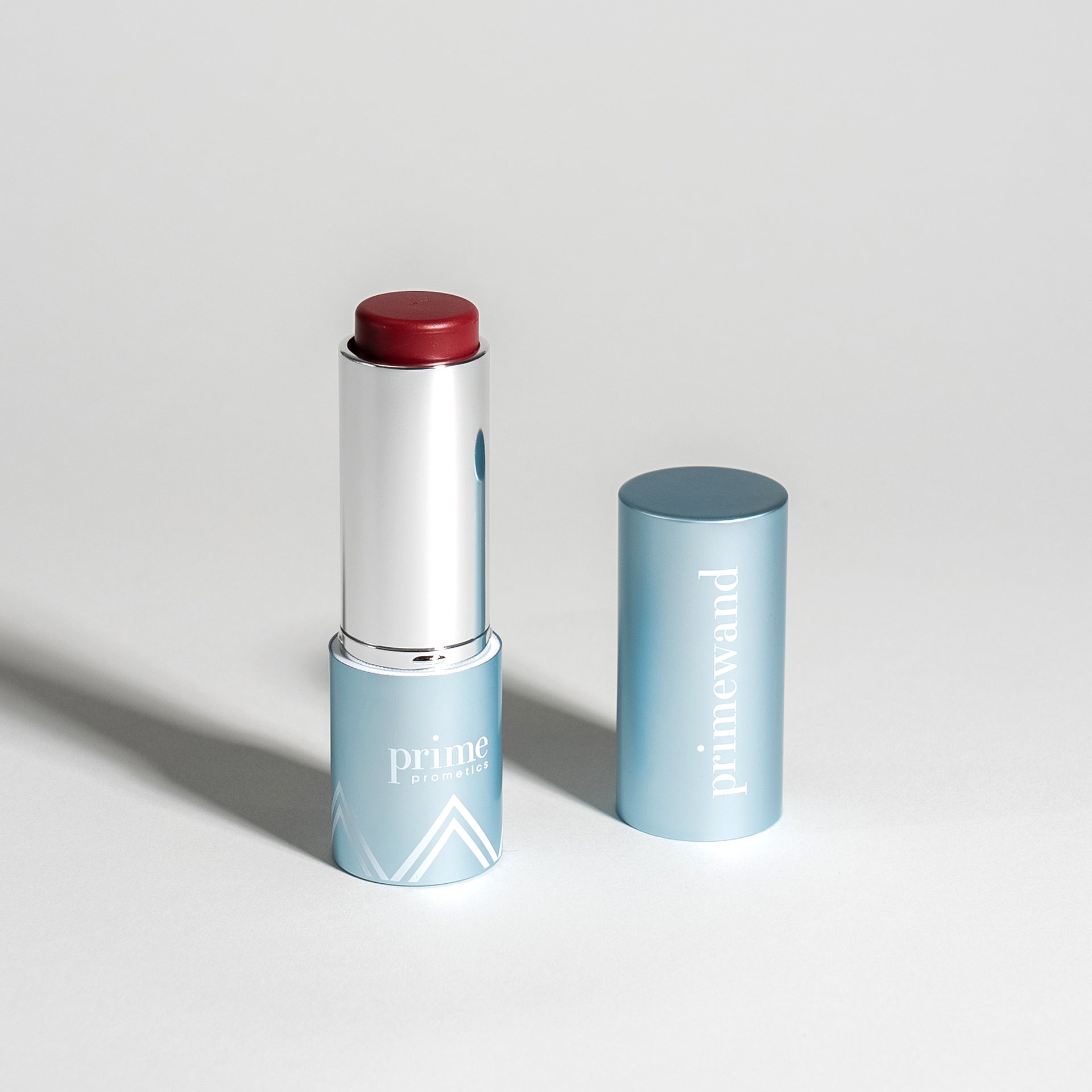 Prime Prometics PrimeWand Pigment in a wine-berry shade with twist-up stick and cap