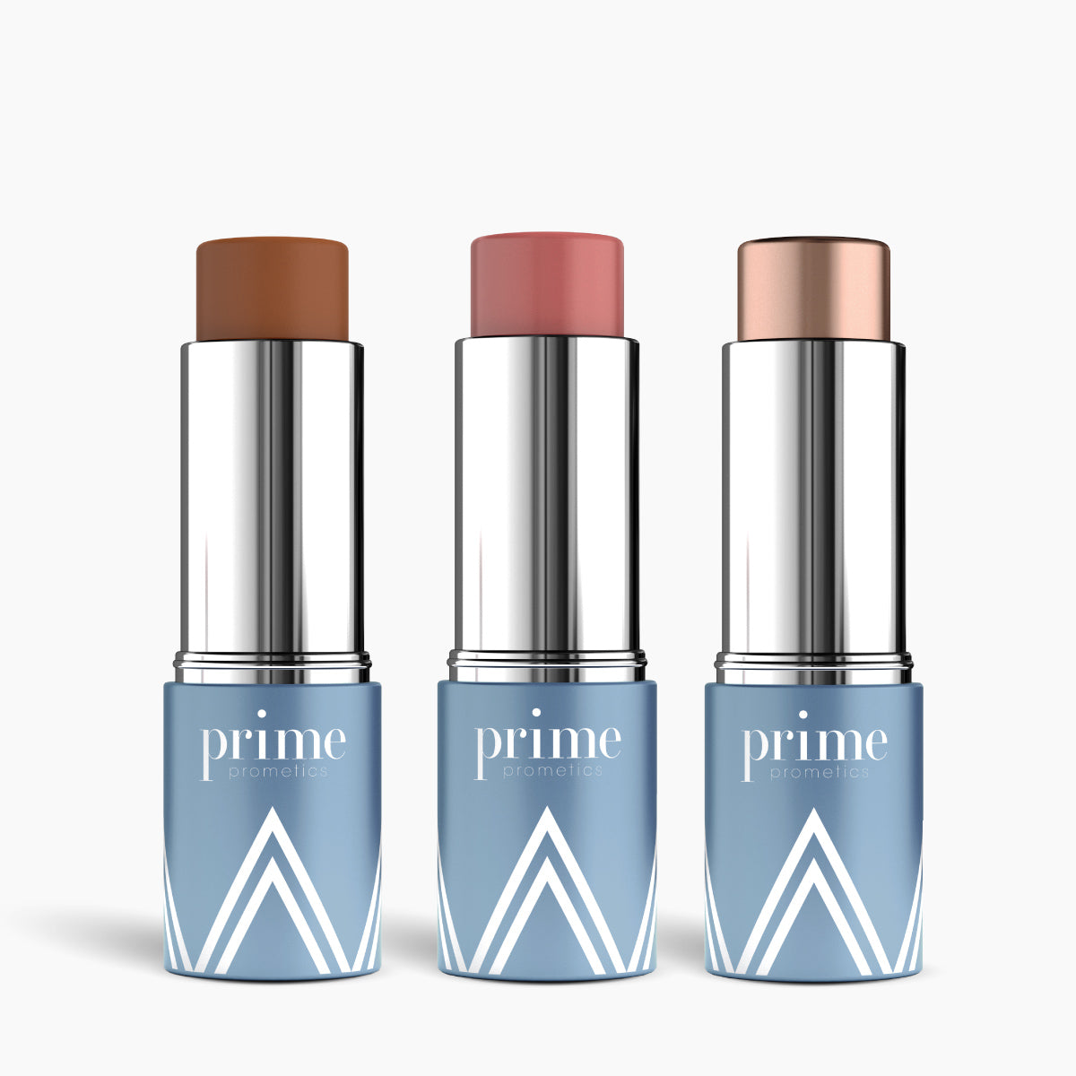 Three makeup sticks from the PrimeWand Contour Kit by PrimePrometics™—including bronzer, highlighter, and blush—stand upright in blue and silver tubes against a white background.