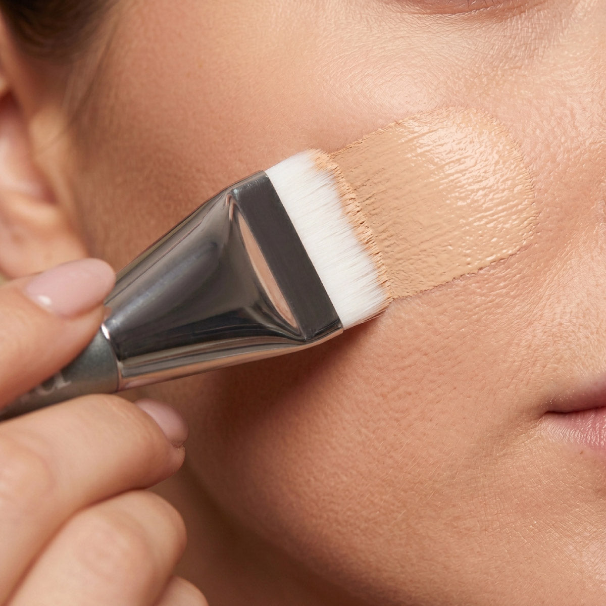 Spatula Brush styled with foundation, designed for full coverage on wrinkled, mature skin