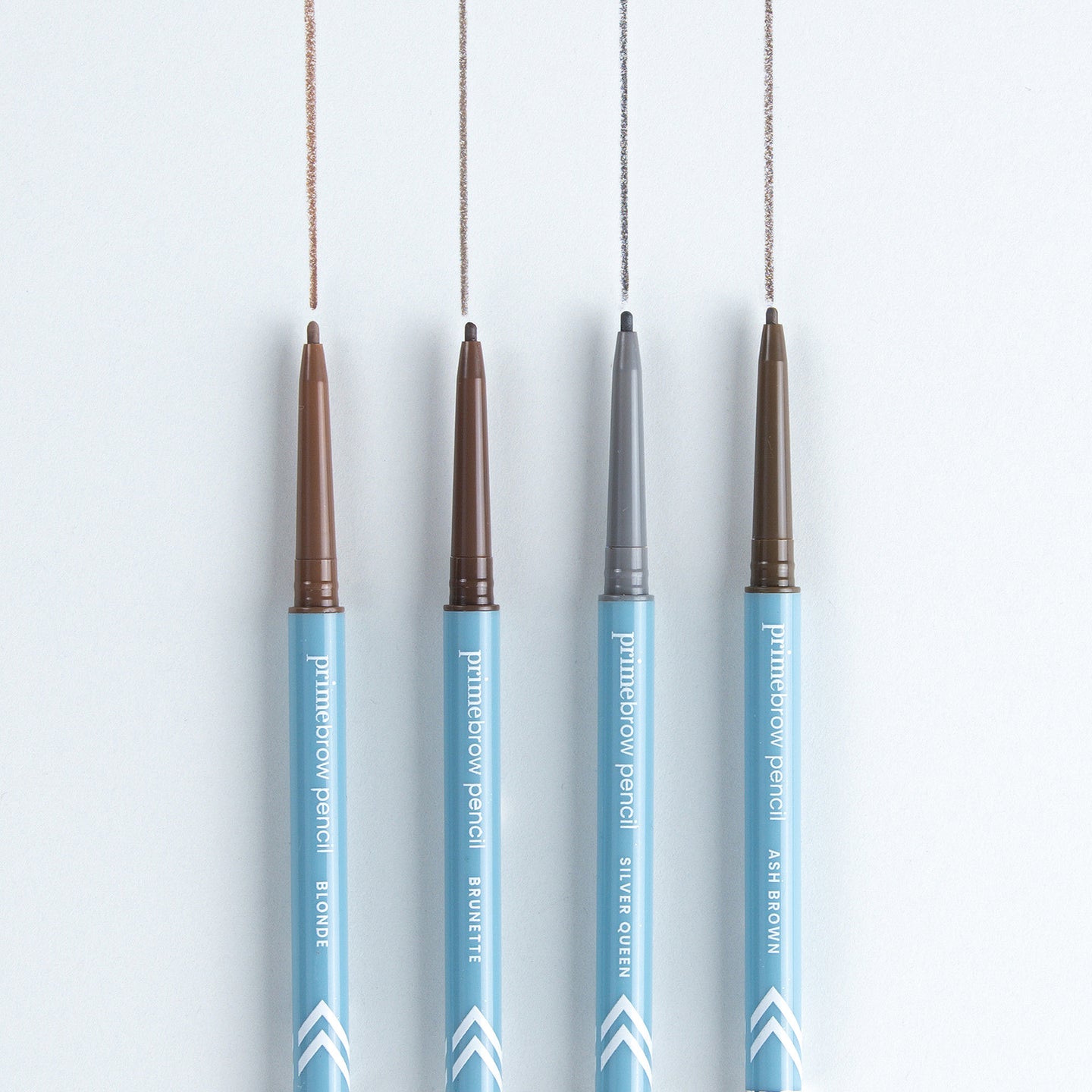 Four PrimePrometics™ Build Your Own Bundle eyebrow pencils with blue bodies stand vertically on a white surface, each drawing a line in a different shade—ideal for pro-age beauty and pairing with your skincare routine.