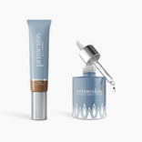 A blue tube and matching bottle from PrimePrometics™ are featured in the Prep & Prime Bundle, with a dropper releasing serum beside the products.