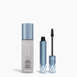 The Simply Gorgeous Duo by PrimePrometics™ features sleek blue and white packaging, displayed with a bottle of color changing foundation and an open tube of volumizer mascara against a white background.