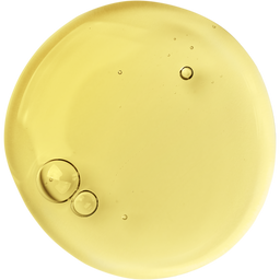 A close-up view of a round, translucent yellow liquid with a few air bubbles suspended inside, set against a plain white background.