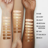 Three arms of different skin tones display eight swatches of foundation shades labeled from 1 (Fair) to 8 (Rich), with corresponding shade names listed beside the arms.