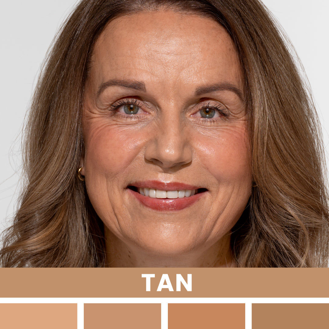 A middle-aged woman with light brown hair and tan skin smiles at the camera. Below her, tan color swatches are displayed with the label “TAN.”.
