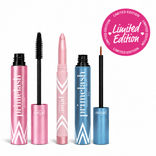 Three makeup products from The Beauty That Gives Set by PrimePrometics™ stand upright in pink and blue tubes. A Limited Edition pink circular label appears at the top right.