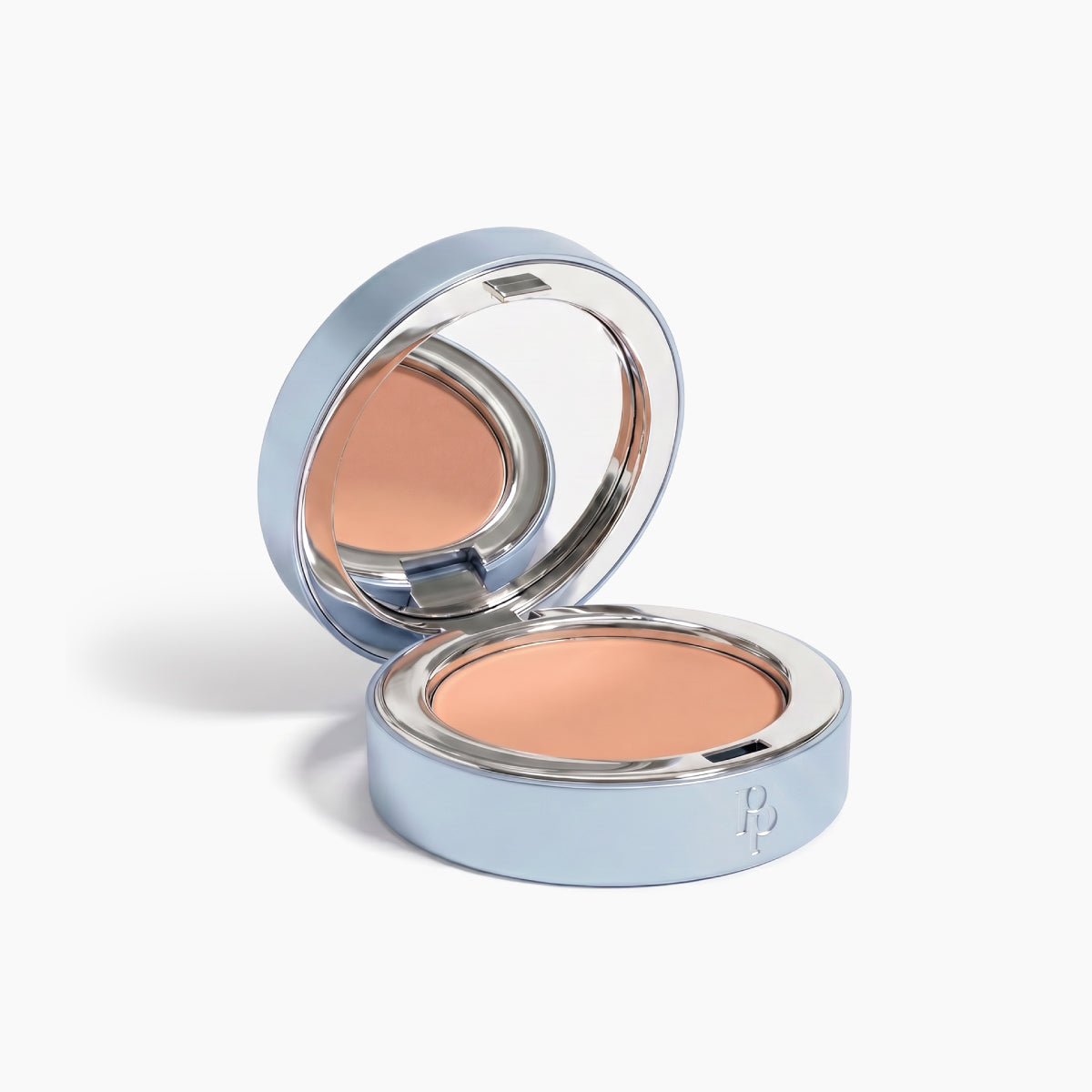 PrimePrometics™ Undereye Brightening Corrector comes in a round blue compact with a mirror lid, revealing pressed beige cream ideal for concealing dark circles and brightening your eye area.