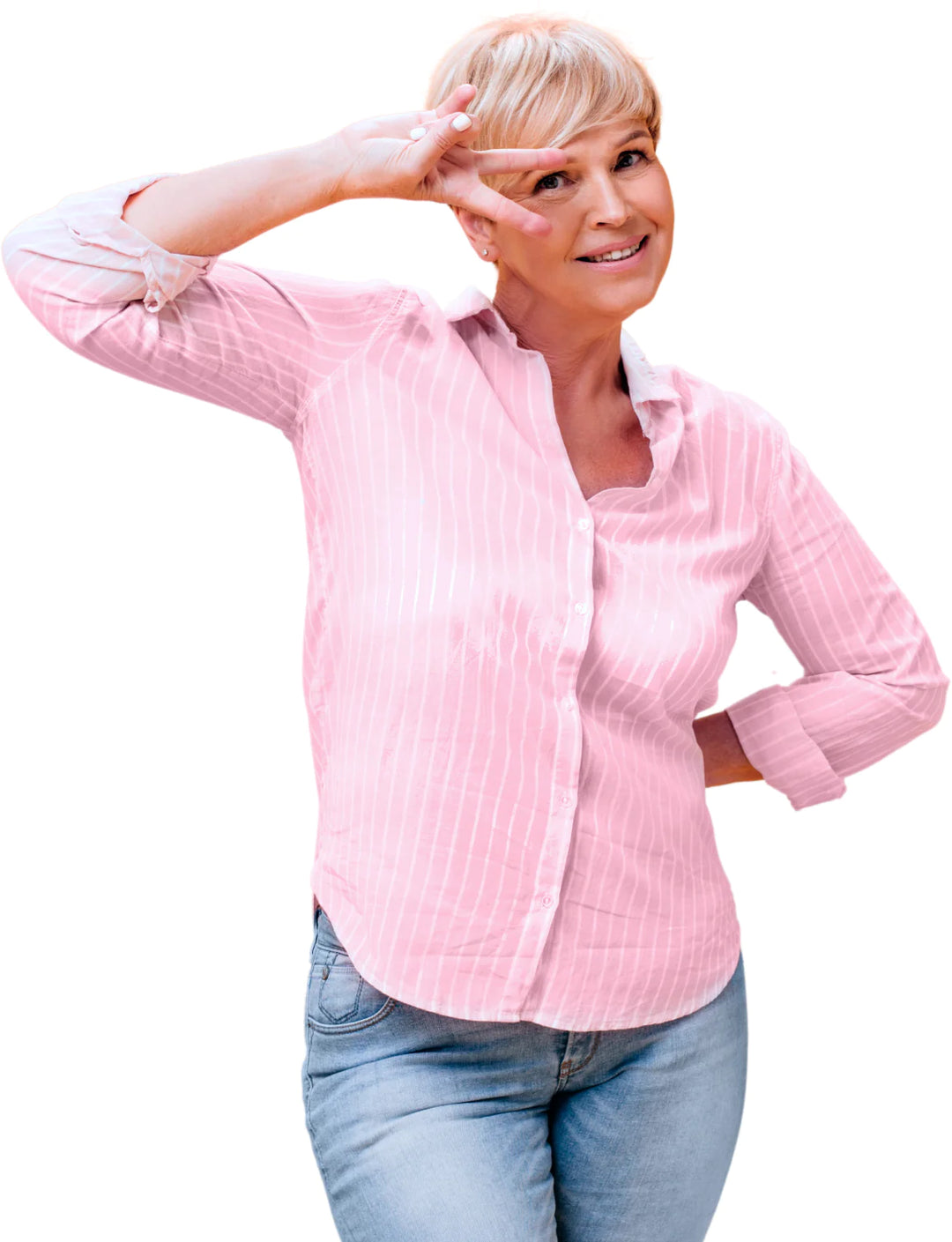 Smiling woman in a pink, striped button-up shirt and blue jeans making a peace sign near her face with one hand, standing with the other hand on her hip.