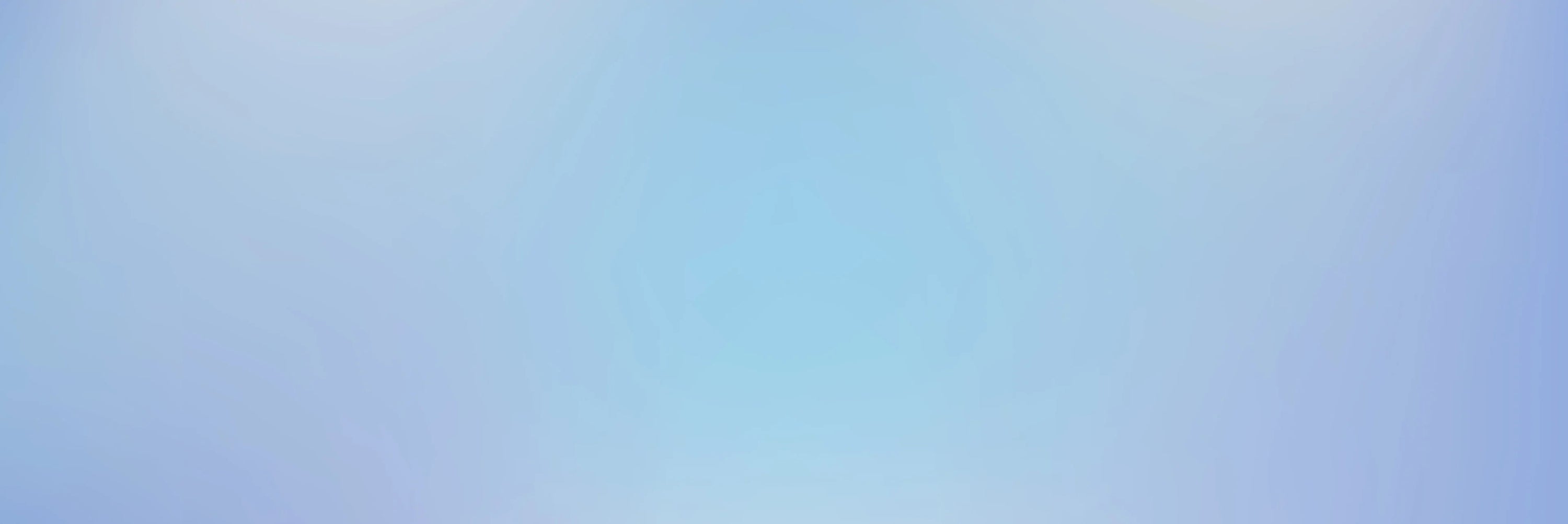 A soft blue gradient background fading to lighter shades at the corners, creating a smooth and calming visual effect with no distinct shapes or objects.