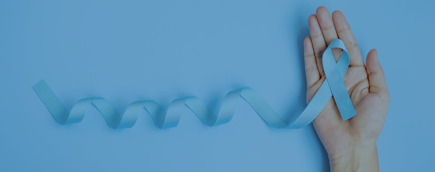 A hand holding a light blue awareness ribbon, with the ribbon extending and curling on a solid light blue background.